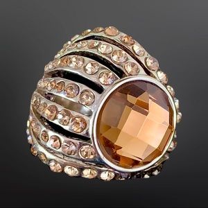 Fashion Jewelry…Gold ring with large Amber stone and small Amber insets.
